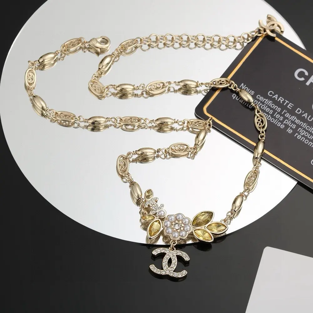 Chanel’s latest gold necklace with letter camellia
