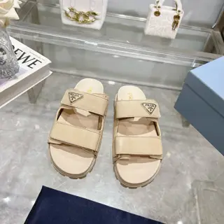 Prada’s latest Prada slippers are 90s-style slipper-style sandals that exude a feminine