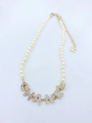 Chanel letter pearl necklace
