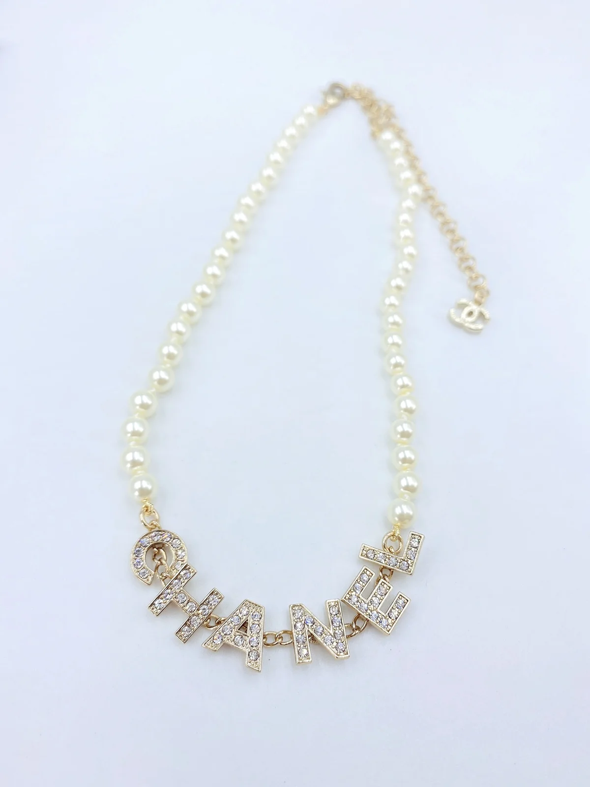 Chanel letter pearl necklace