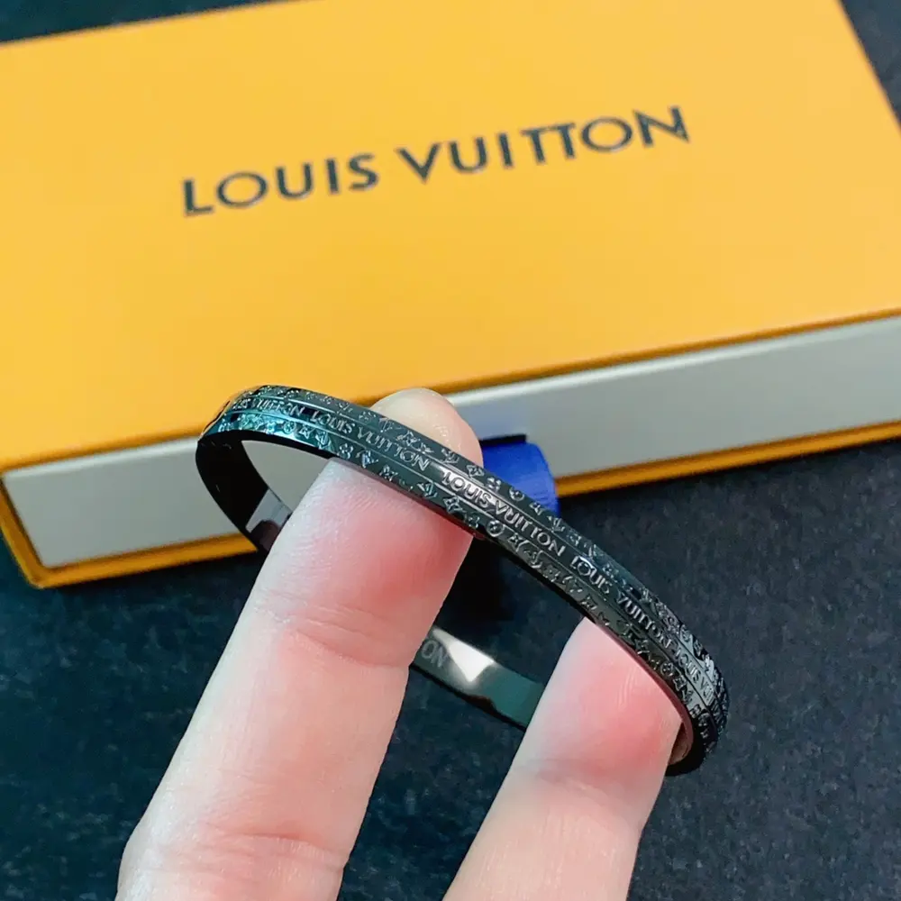 Louis Vuitton black charcoal lettering engraved bracelet