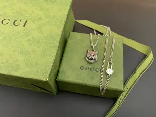 Gucci tiger head cross necklace