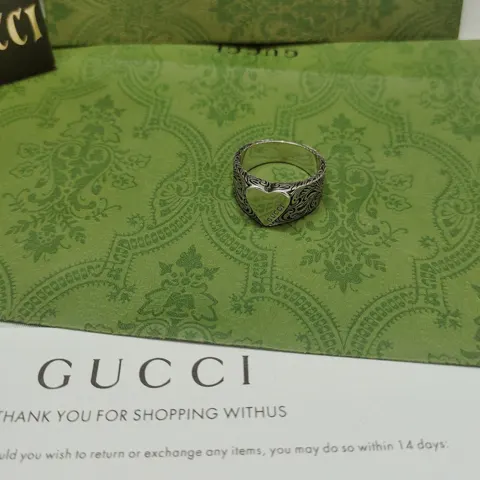 Gucci This heart ring This distinctive heart-shaped band with engraved details makes this