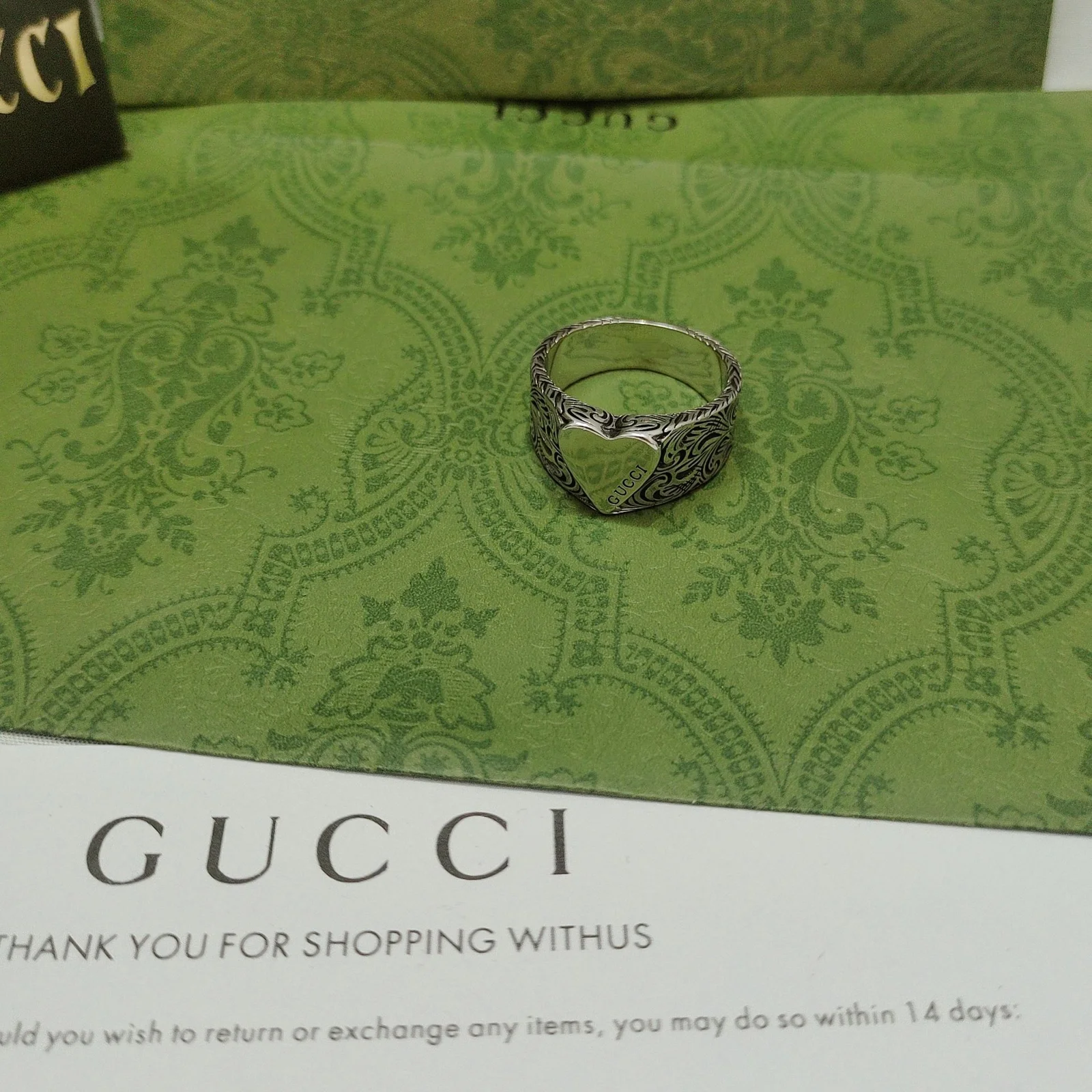 Gucci This heart ring This distinctive heart-shaped band with engraved details makes this