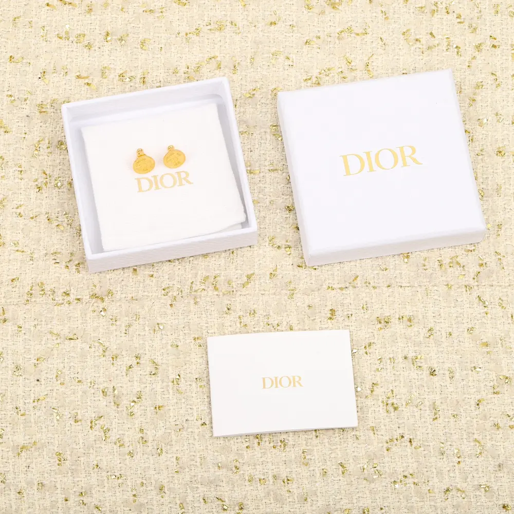 [Dior coin earrings] are vintage