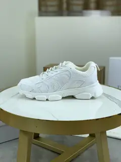 Dior CHRONO shoes have a lot of silver shiny structures with gray mesh materials. The soles