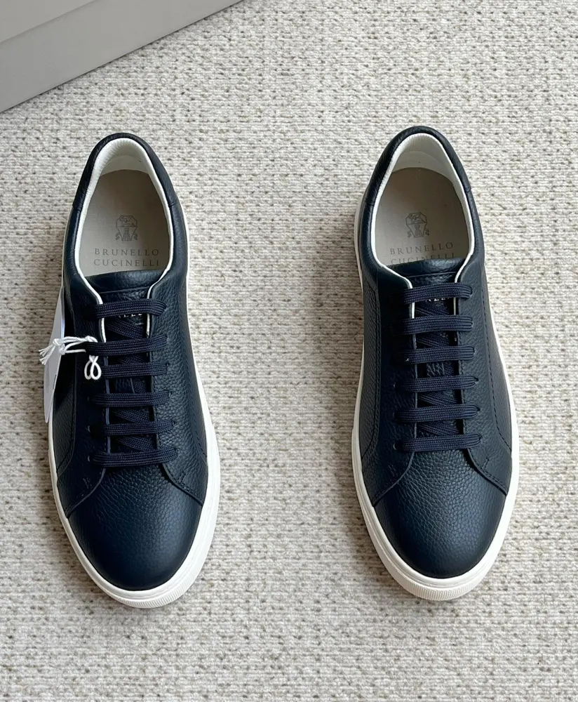 Brunello Cucinelli color-blocked sports flats for men. This pair of flat sports shoes
