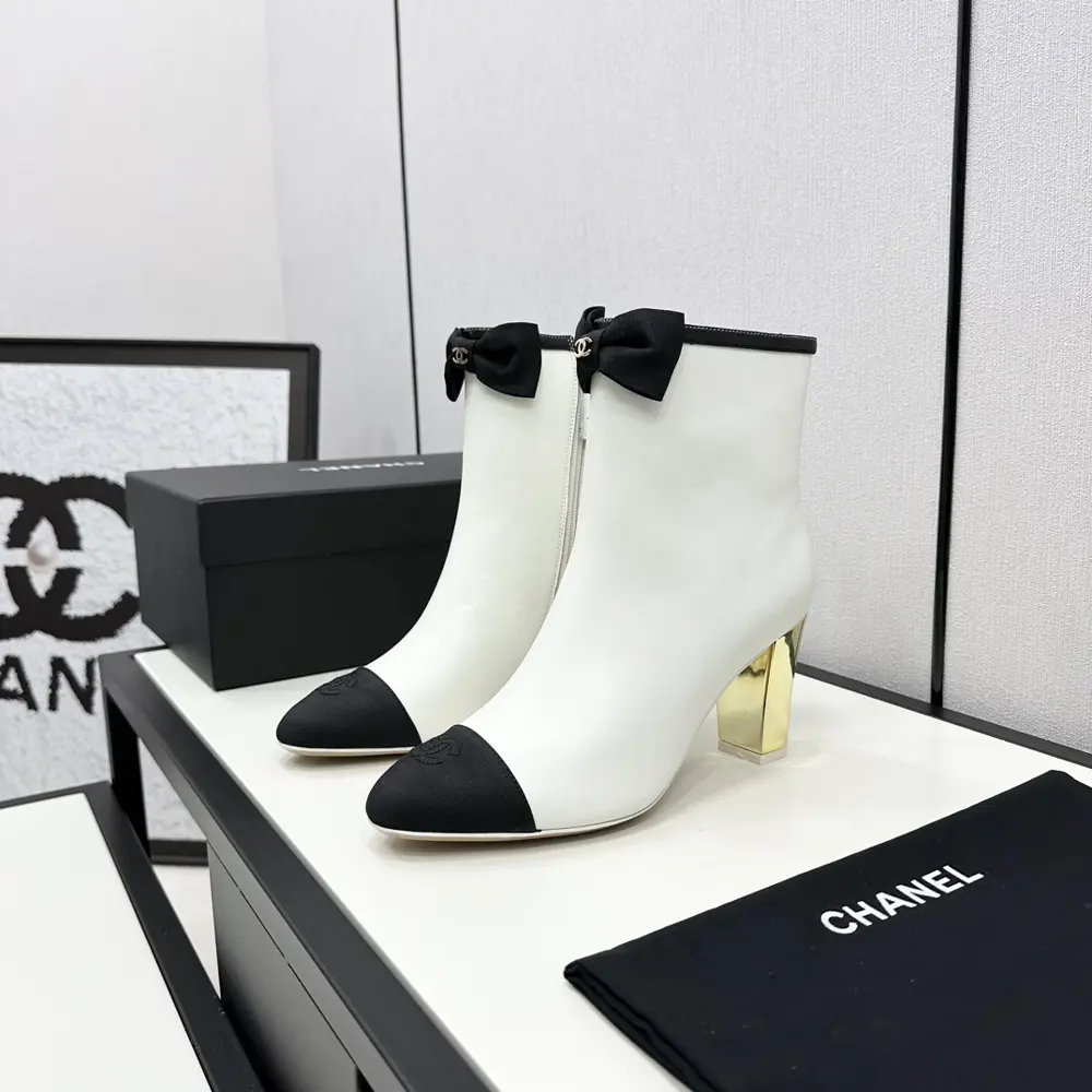 Chanel high-heeled ankle boots with bows