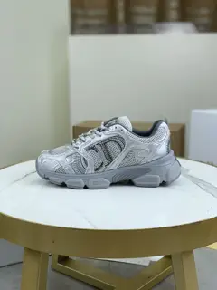 Dior CHRONO shoes have a lot of silver shiny structures with gray mesh materials. The soles