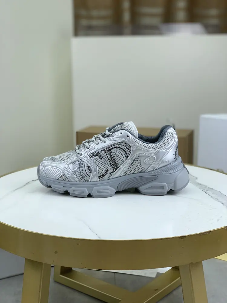 Dior CHRONO shoes have a lot of silver shiny structures with gray mesh materials. The soles