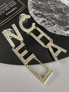 Chanel diamond letter earrings