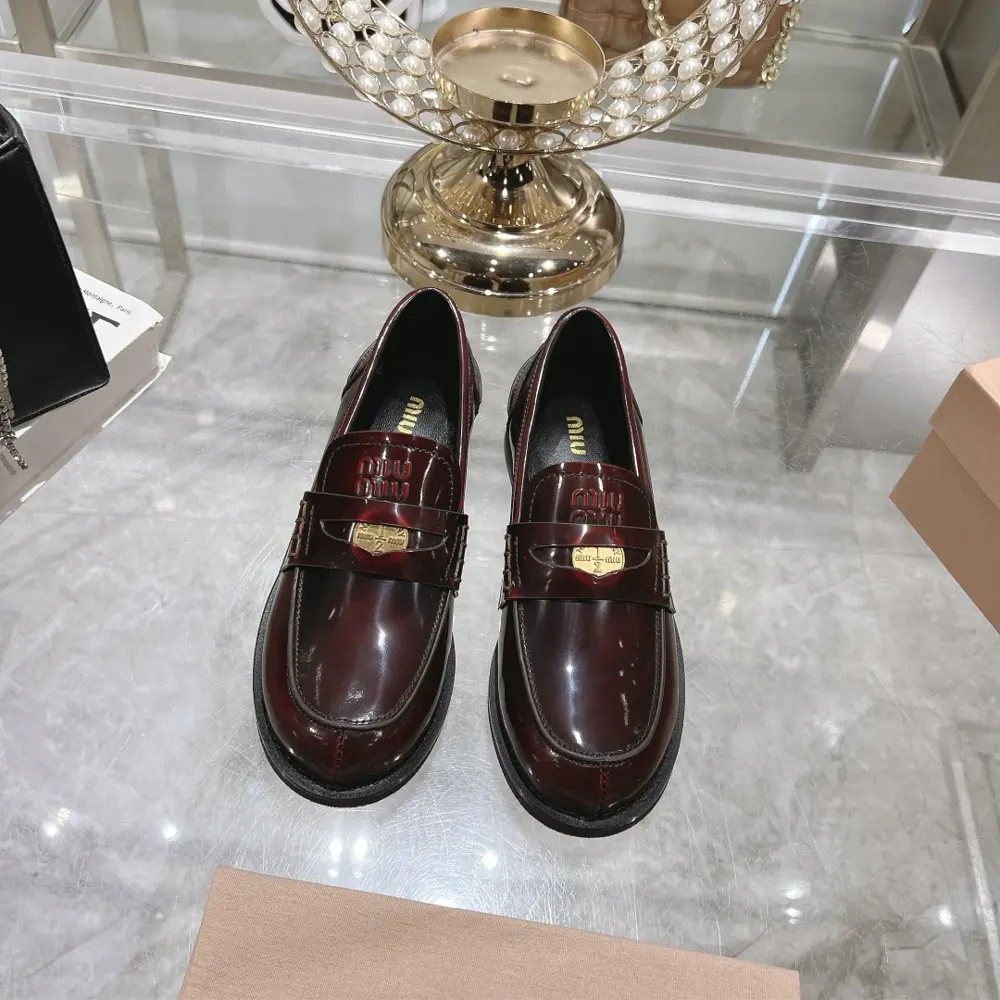 MIUMIU high-heeled coin loafers are recommended