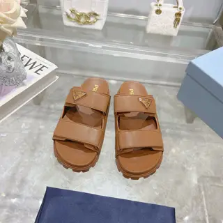 Prada’s latest Prada slippers are 90s-style slipper-style sandals that exude a feminine