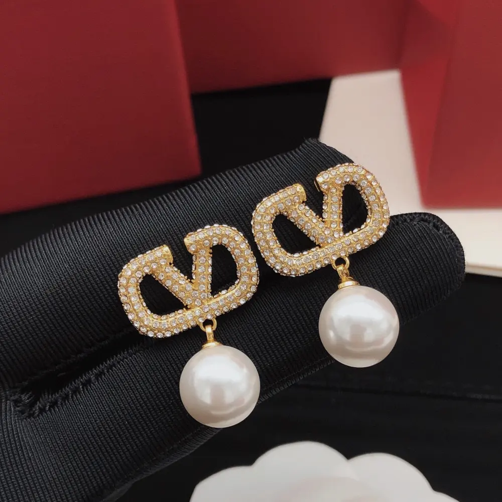 Valentino V-shaped earrings with diamonds and pearls