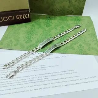 GUcci logo and light green grey enamel coating details. Light and bright tones complement