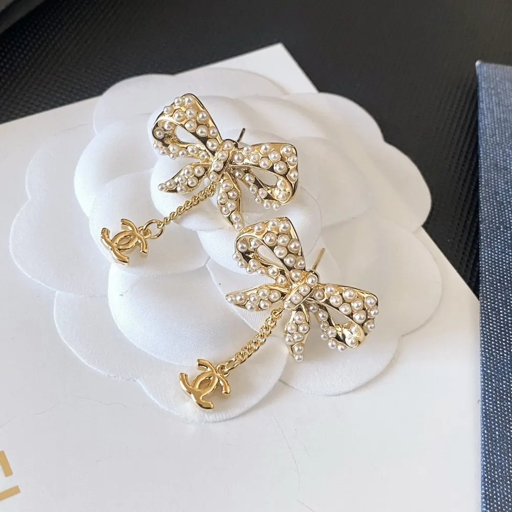 Chanel bow pearl earrings