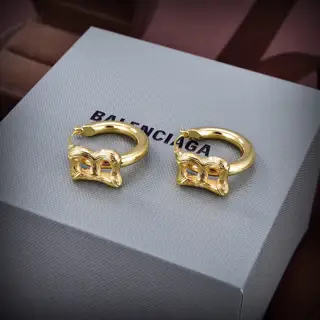 Balenciaga gold stud earrings