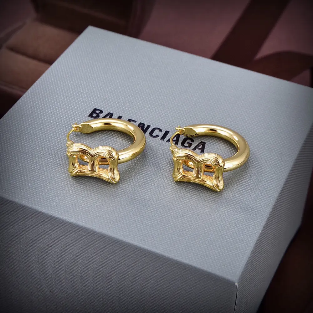 Balenciaga gold stud earrings