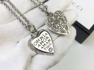Gucci’s heart-shaped pendant necklace with a new slogan symbolizes love is decorated with