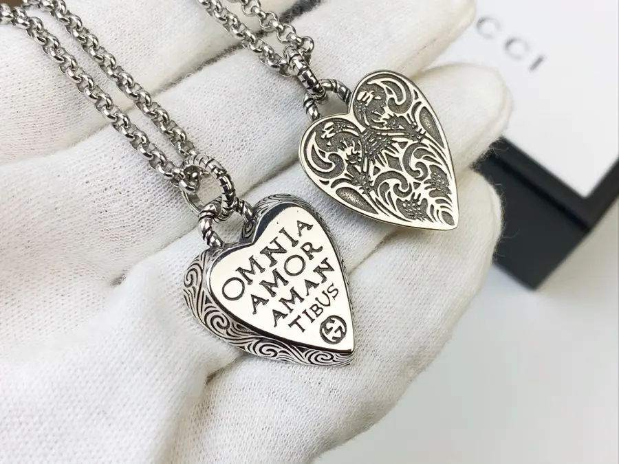 Gucci’s heart-shaped pendant necklace with a new slogan symbolizes love is decorated with