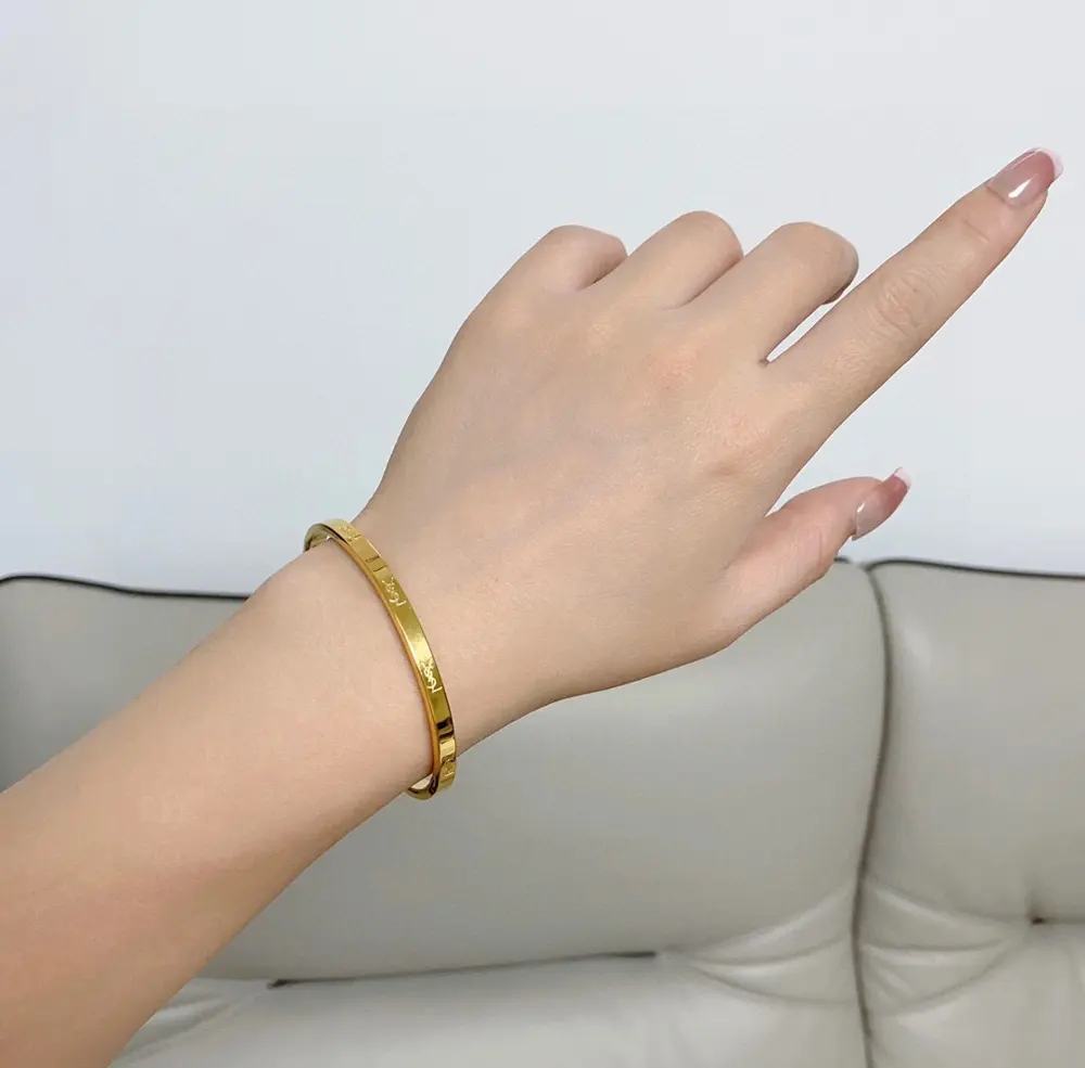 Yves Saint Laurent narrow bracelet with engraved letters