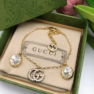 Gucci Double G Bracelet The highly recognizable Double G logo with a large gem Different
