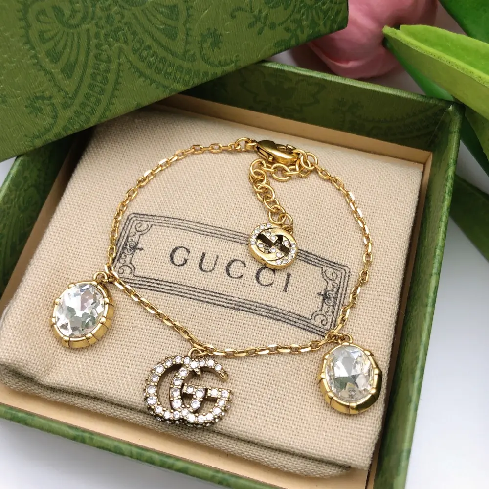 Gucci Double G Bracelet The highly recognizable Double G logo with a large gem Different