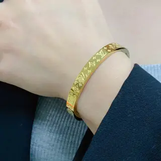 Louis Vuitton narrow logo bracelet with engraved letters