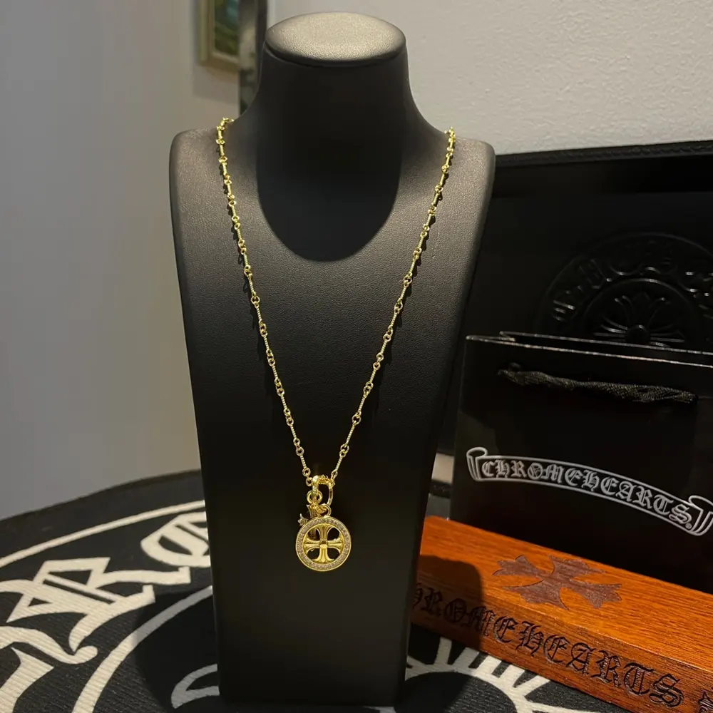 Chrome Hearts classic yellow gold twist necklace with cross pendant