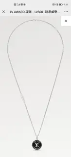 Louis Vuitton enamel medallion hanging from a thin chain necklace