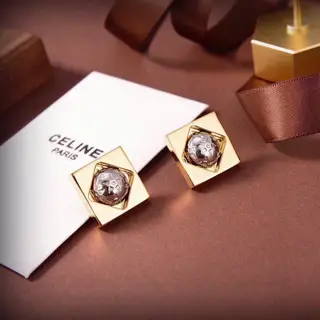 Celine gold planet earrings