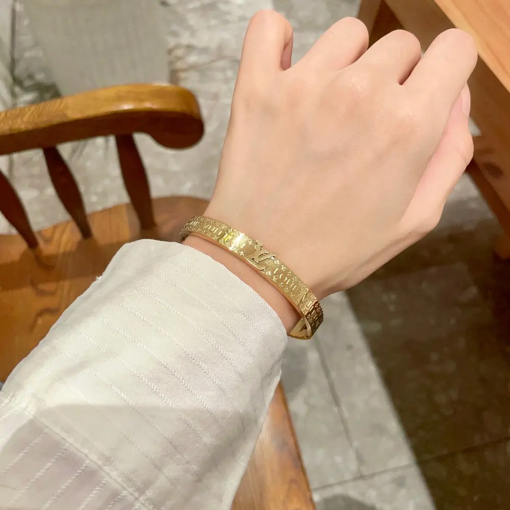 Louis Vuitton engraved lettering bracelet