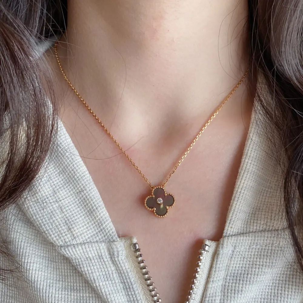 Van Cleef & Arpels natural grey shell with diamond backing and four-leaf clover necklace