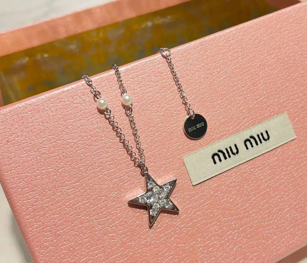 miumiu necklace is hand-inlaid with diamond stars