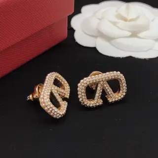 Valentino earrings with V-shaped diamonds and rice beads